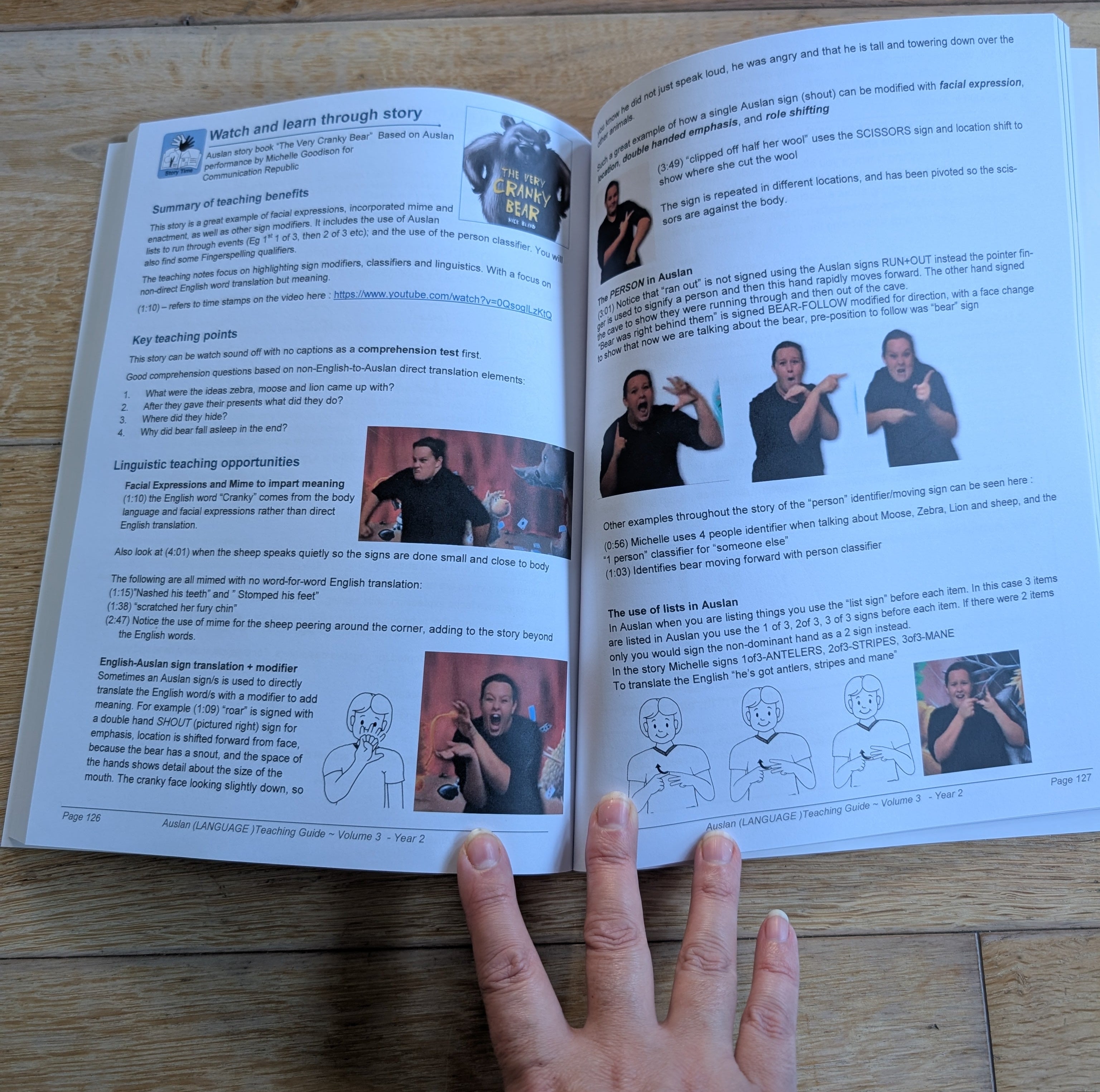 Auslan teaching guide volume 3 open on table showing teaching notes on cranky bear story