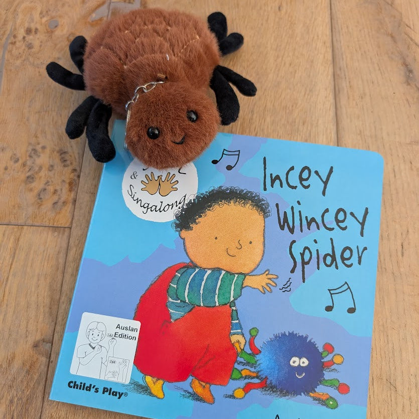 Plush spider toy on a 'Incey Wincey Spider' book 