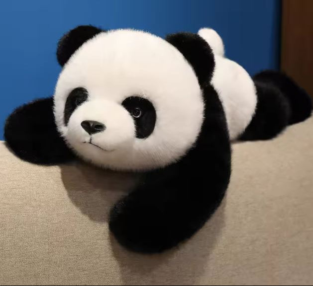 Portly Panda weighted plush on couch