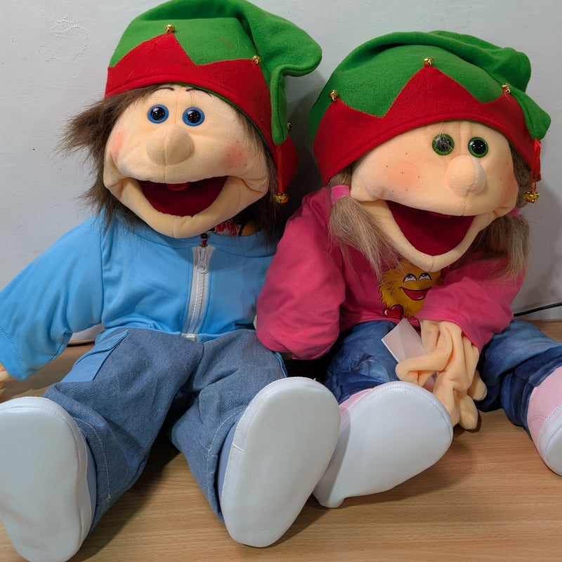 Two plush signing dolls wearing their christmas elf hats.